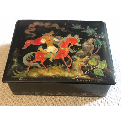 1414 - A beautiful Palekh Russian lacquered painted cigarette box with warrior riding a horse in full armou... 