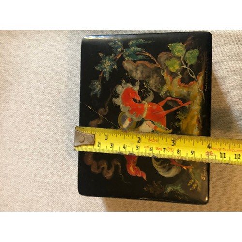 1414 - A beautiful Palekh Russian lacquered painted cigarette box with warrior riding a horse in full armou... 
