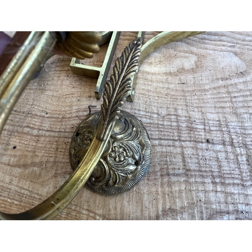 1587 - Pair of brass curtain pole supports and a brass wall light