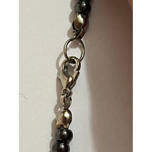 1619 - hematite bib or collar necklace featuring a graduated fringe design. The necklace is made from dark ... 