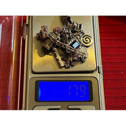 1784 - Silver Charm bracelet with silver charms 17.9g