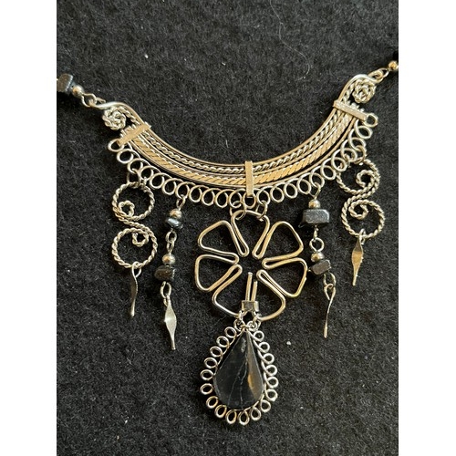 1857 - An Indian white metal necklace and earring set with black agate type stones.