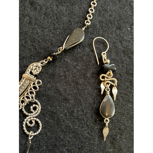 1857 - An Indian white metal necklace and earring set with black agate type stones.