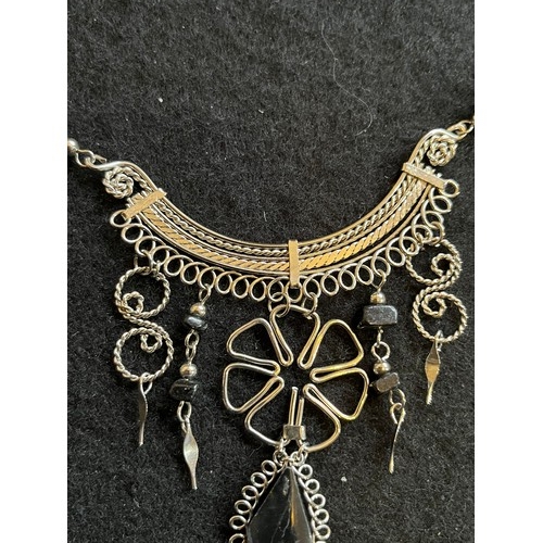 1857 - An Indian white metal necklace and earring set with black agate type stones.