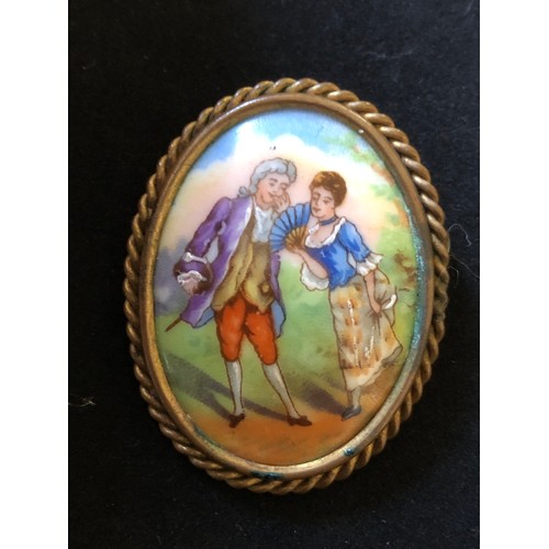 1875 - Pretty Limoges France convex hand painted porcelain brooch set in a ropework gold plated frame with ... 