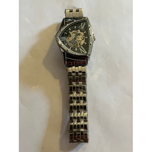 1888 - Duncougar automatic watch. Never worn with plastic covers on face and strap. Stainless steel