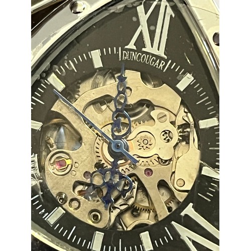 1888 - Duncougar automatic watch. Never worn with plastic covers on face and strap. Stainless steel