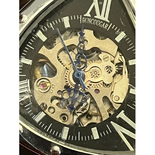 1888 - Duncougar automatic watch. Never worn with plastic covers on face and strap. Stainless steel