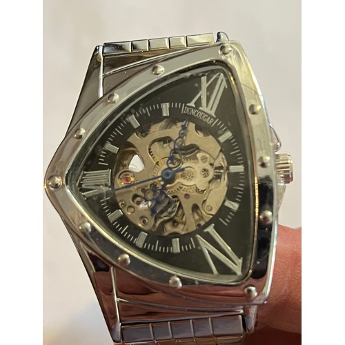1888 - Duncougar automatic watch. Never worn with plastic covers on face and strap. Stainless steel
