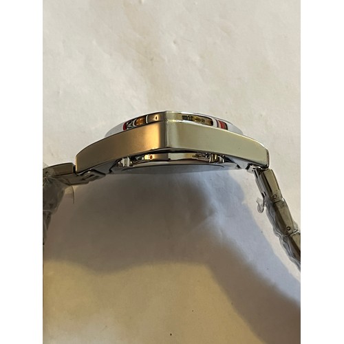 1888 - Duncougar automatic watch. Never worn with plastic covers on face and strap. Stainless steel