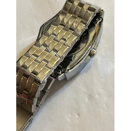 1888 - Duncougar automatic watch. Never worn with plastic covers on face and strap. Stainless steel