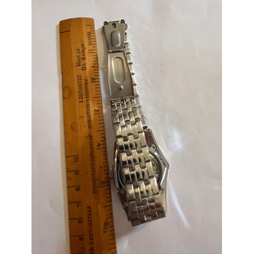 1888 - Duncougar automatic watch. Never worn with plastic covers on face and strap. Stainless steel