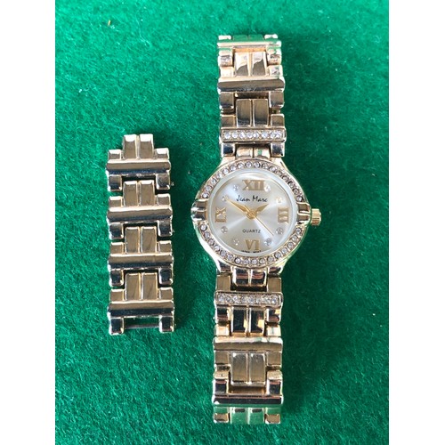 1906 - Jean Marc quartz watch in gold plate and bling.