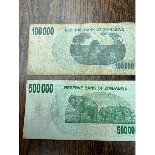 116 - Pair of Zimbabwe hyperinflation banknotes comprising 100,000 and 500,000 Dollar bearer cheques issue... 