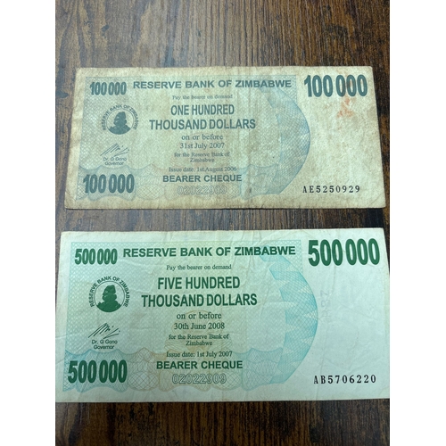 116 - Pair of Zimbabwe hyperinflation banknotes comprising 100,000 and 500,000 Dollar bearer cheques issue... 