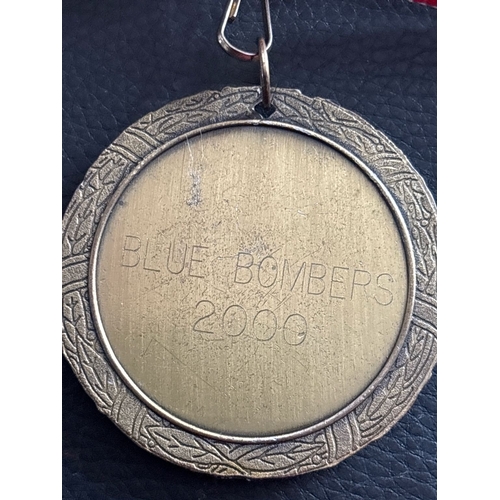 6 - Blue Bombers Baseball Medal – 2000  Award medal presented to a member of the “Blue Bombers” baseball... 