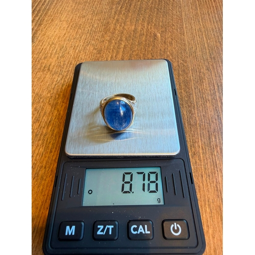 5 - A large 10ct sapphire like cabachon gemstone diamond ring 14 k gold Size- approx N