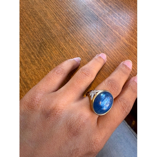 5 - A large 10ct sapphire like cabachon gemstone diamond ring 14 k gold Size- approx N