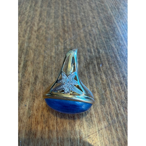 5 - A large 10ct sapphire like cabachon gemstone diamond ring 14 k gold Size- approx N