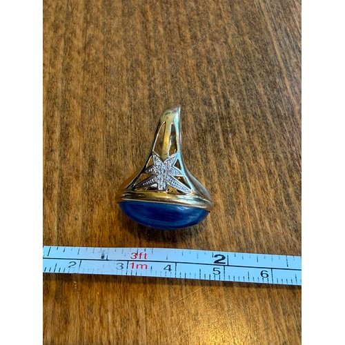 5 - A large 10ct sapphire like cabachon gemstone diamond ring 14 k gold Size- approx N