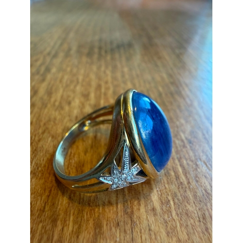 5 - A large 10ct sapphire like cabachon gemstone diamond ring 14 k gold Size- approx N