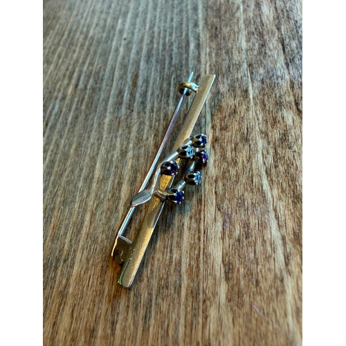 24 - A lucky horse shoe diamond sapphire and ruby high k gold antique brooch