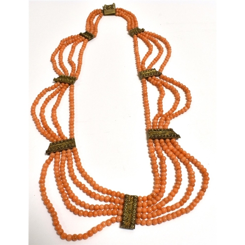 23 - ANTIQUE CORAL FESTOON NECKLACE Of collier d'esclavage style, 46cm long, consisting of five rows of 3... 