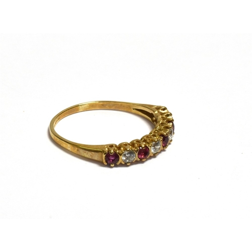 35 - 9CT GOLD RUBY & CZ ETERNITY 3.1mm wide head with round mixed cut rubies alternating with cubic zirco... 