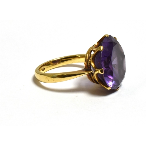 36 - 18CT GOLD SYNTHETIC SAPPHIRE RING With a coronet claw set round synthetic sapphire stone imitating A... 