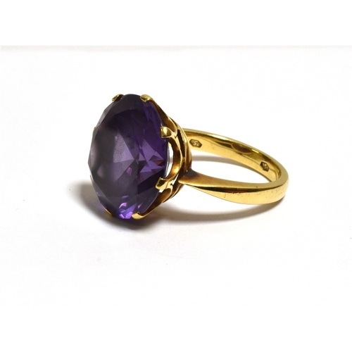 36 - 18CT GOLD SYNTHETIC SAPPHIRE RING With a coronet claw set round synthetic sapphire stone imitating A... 