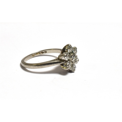 37 - PLATINUM & DIAMOND FLORAL CLUSTER RING 11.4mm floral cluster head, set with an estimated 1.05 carats... 