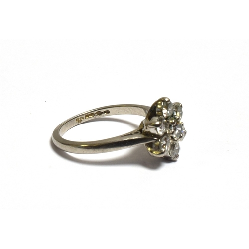 37 - PLATINUM & DIAMOND FLORAL CLUSTER RING 11.4mm floral cluster head, set with an estimated 1.05 carats... 