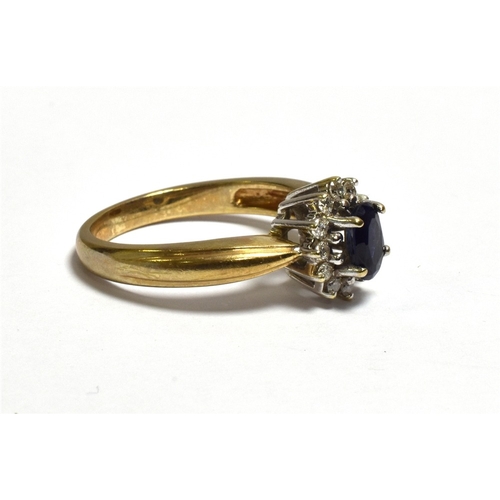 43 - SAPPHIRE & DIAMOND HALO CLUSTER RING claw set with an oval sapphire, estimated 0.60 carats surrounde... 