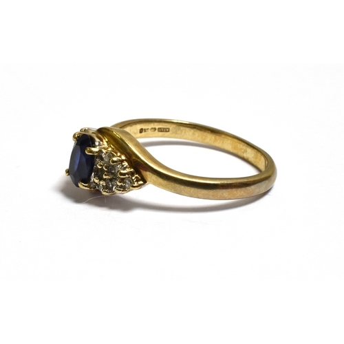 44 - SAPPHIRE AND DIAMOND DRESS RING claw set with an oval sapphire, estimated 0.60 carats, flanked by gr... 