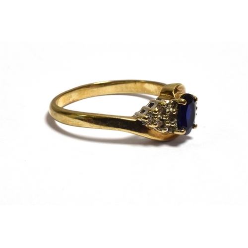 44 - SAPPHIRE AND DIAMOND DRESS RING claw set with an oval sapphire, estimated 0.60 carats, flanked by gr... 