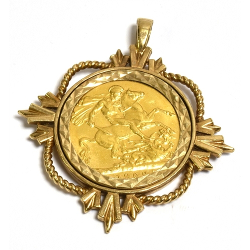 48 - 22CT GOLD FULL SOVEREIGN PENDANT Dated 1909, spectacle set within an intricate 9ct gold frame, featu... 