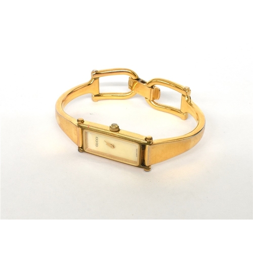 65 - LADIES GUCCI WRISTWATCH 12.2mm wide rectangular gold plated case, signed Gucci reference 1500, mothe... 