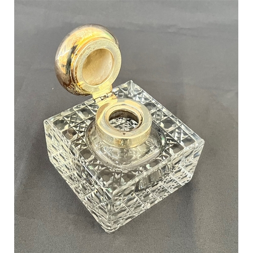 90 - EDWARDIAN SILVER MOUNTED INKWELL On 9cm square hob nail cut crystal base, with hinged sterling silve... 