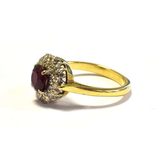 15 - 18CT GOLD RUBY & DIAMOND CLUSTER RING 10.6mm diameter, halo style cluster, set with an oval ruby, of... 