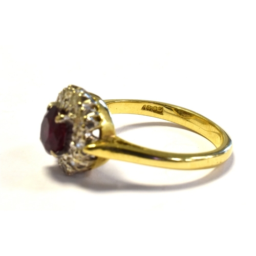 15 - 18CT GOLD RUBY & DIAMOND CLUSTER RING 10.6mm diameter, halo style cluster, set with an oval ruby, of... 