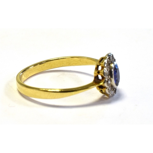 21 - 18CT GOLD SAPPHIRE & DIAMOND RING 9.3 x 8.6mm oval cluster, with central bezel set oval sapphire, es... 