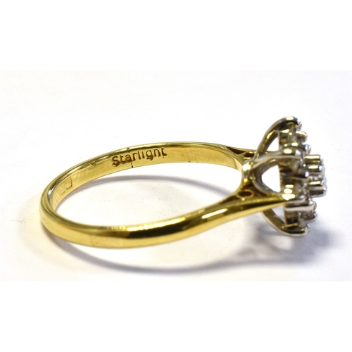 24 - 18CT GOLD & DIAMOND RING with a 10.7mm claw set basket, holding a cluster of single cut and one roun... 