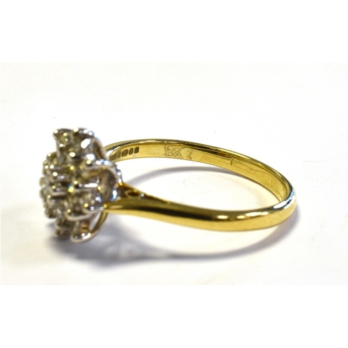 24 - 18CT GOLD & DIAMOND RING with a 10.7mm claw set basket, holding a cluster of single cut and one roun... 