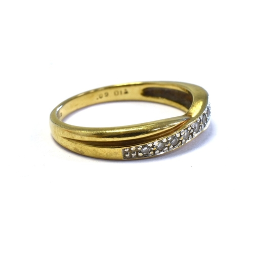 47 - 9CT GOLD & DIAMOND SET ETERNITY RING a cross over band style head, grain set with round brilliant cu... 