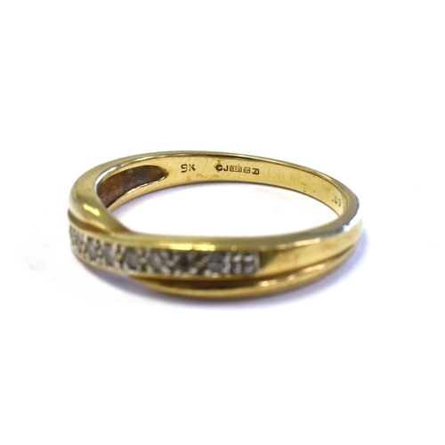 47 - 9CT GOLD & DIAMOND SET ETERNITY RING a cross over band style head, grain set with round brilliant cu... 