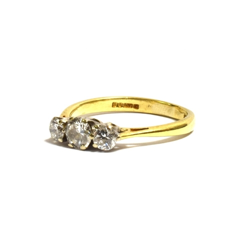 49 - 18CT GOLD THREE STONE DIAMOND RING featuring white gold, claw set round brilliant cut diamonds, esti... 