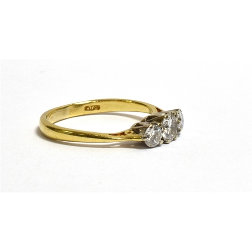 49 - 18CT GOLD THREE STONE DIAMOND RING featuring white gold, claw set round brilliant cut diamonds, esti... 