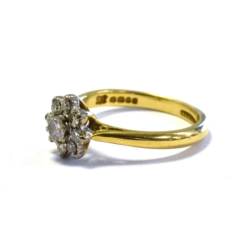 55 - 18CT GOLD & DIAMOND FLORAL CLUSTER RING set with one round brilliant cut and eight single cut diamon... 