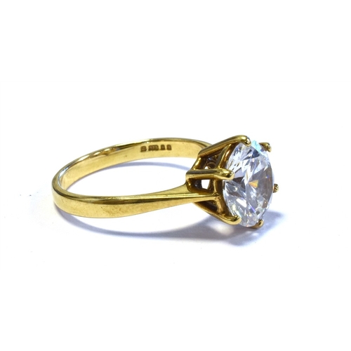 62 - 9CT GOLD SOLITAIRE RING claw set with a round brilliant cut cubic zirconia stone, ring size M, hallm... 