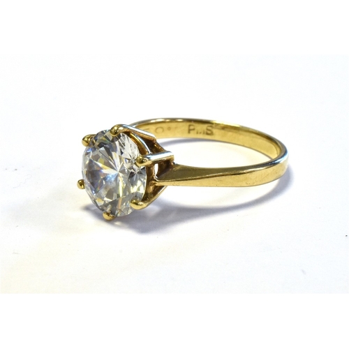 62 - 9CT GOLD SOLITAIRE RING claw set with a round brilliant cut cubic zirconia stone, ring size M, hallm... 